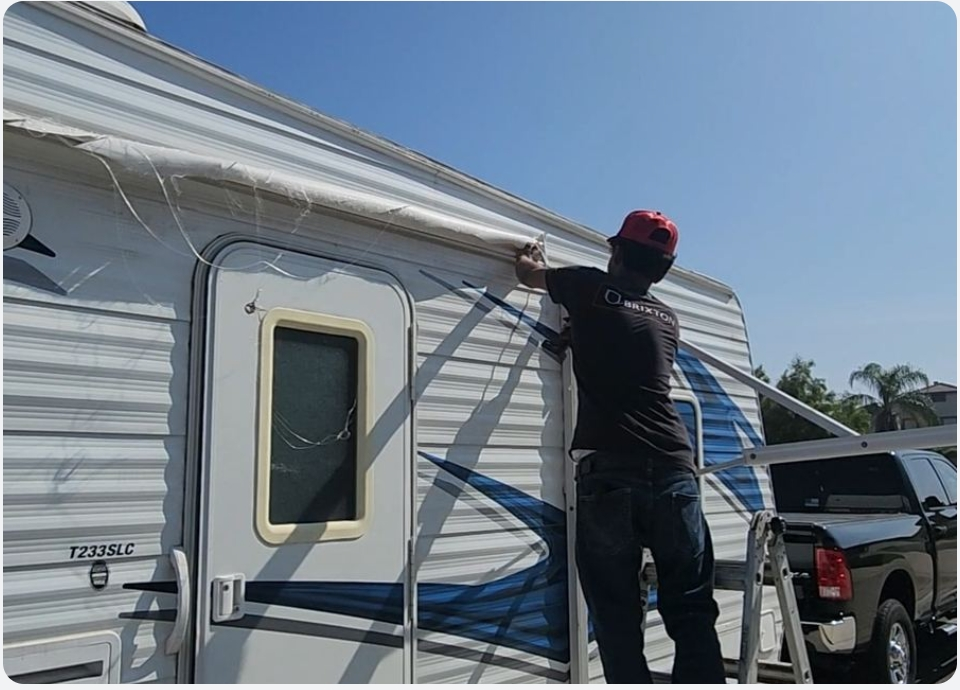 RV awning fabric being replaced on a travel trailer